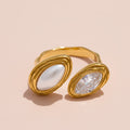 Gold ring with two distinct gemstones